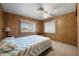Cozy bedroom features neutral carpet, window views, and a ceiling fan at 3160 E Main St # 110, Mesa, AZ 85213