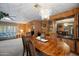 Bright dining area with stylish chandelier and views into the living room at 3160 E Main St # 110, Mesa, AZ 85213