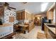 The expansive kitchen features an attached desk and flows to the dining room at 3160 E Main St # 110, Mesa, AZ 85213