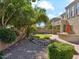 Backyard features pavers, built-in grill, lush landscape, and artificial turf at 3221 E Lynx Pl, Chandler, AZ 85249