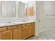 Bathroom features a double vanity, mosaic tile backsplash, and decorative tile flooring at 3221 E Lynx Pl, Chandler, AZ 85249