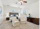 Bright bedroom with a seating area, ensuite, and a neutral color palette at 3221 E Lynx Pl, Chandler, AZ 85249