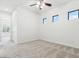 A bright bedroom features recessed lights, a ceiling fan and minimal decor at 3221 E Lynx Pl, Chandler, AZ 85249