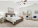 Cozy bedroom with a large bed, plush carpet, plantation shutters, and stylish decor at 3221 E Lynx Pl, Chandler, AZ 85249