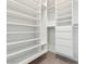 Walk-in closet with custom shelving and storage, providing ample organizational space at 3221 E Lynx Pl, Chandler, AZ 85249