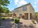 Backyard with low maintenance landscape, outdoor kitchen, and covered patio at 3221 E Lynx Pl, Chandler, AZ 85249