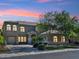 Charming two-story home featuring a well-manicured lawn, mature trees, and a private two-car garage at 3221 E Lynx Pl, Chandler, AZ 85249