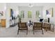 Inviting living room with views to the backyard, neutral tones, and plantation shutters at 3221 E Lynx Pl, Chandler, AZ 85249