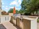 Outdoor kitchen complete with built-in gas grill, countertops, and storage at 3221 E Lynx Pl, Chandler, AZ 85249