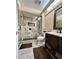 The remodeled bathroom has walk-in shower with decorative tile, and dark wood vanity at 3535 W Monte Cristo Ave # 129, Phoenix, AZ 85053
