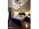 Comfortable bedroom featuring a large bed, wood floors and natural light at 3535 W Monte Cristo Ave # 129, Phoenix, AZ 85053
