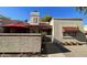 Charming home with stucco, a red awning, lovely landscaping and a private patio area at 3535 W Monte Cristo Ave # 129, Phoenix, AZ 85053
