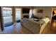Inviting living room with hardwood floors and a fireplace is open to dining and kitchen at 3535 W Monte Cristo Ave # 129, Phoenix, AZ 85053