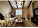 Inviting living room with exposed wood beams and comfortable seating at 3535 W Monte Cristo Ave # 129, Phoenix, AZ 85053