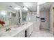 Spacious bathroom featuring double sinks, white countertops, and a shower and tub combo at 3755 E Broadway Rd # 36, Mesa, AZ 85206