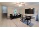 Cozy living room featuring a flat screen television, dark furniture, and a ceiling fan at 3755 E Broadway Rd # 36, Mesa, AZ 85206