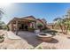 Expansive backyard with covered patio, fire pit, and lush landscaping, perfect for entertaining at 3915 S 186Th Ln, Goodyear, AZ 85338