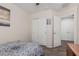 This bedroom features a neutral color palette, tiled floors, and a double door closet at 3915 S 186Th Ln, Goodyear, AZ 85338