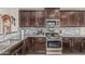 Well-equipped kitchen with stainless steel appliances, granite countertops, and plenty of storage at 3915 S 186Th Ln, Goodyear, AZ 85338