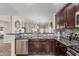 View of open kitchen featuring stainless steel appliances, granite countertops, and decorative tile backsplash at 3915 S 186Th Ln, Goodyear, AZ 85338