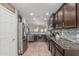 Spacious kitchen featuring stainless steel appliances, granite countertops, and ample cabinet space at 3915 S 186Th Ln, Goodyear, AZ 85338