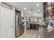 Modern kitchen featuring stainless steel appliances, granite countertops, and ample cabinet space at 3915 S 186Th Ln, Goodyear, AZ 85338
