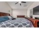 Cozy main bedroom with a ceiling fan and a window offering natural light at 3915 S 186Th Ln, Goodyear, AZ 85338