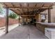 Covered patio complete with dining area and outdoor grill at 3915 S 186Th Ln, Goodyear, AZ 85338