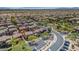 Expansive aerial view of a well-planned community with tree-lined streets, manicured landscaping, and mountain views in the distance at 3932 E Melinda Dr, Phoenix, AZ 85050