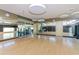 Bright fitness studio with mirrored walls, wood floors, and a view of the gym beyond the glass wall at 3932 E Melinda Dr, Phoenix, AZ 85050