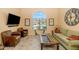 Inviting living room with large arched window, comfortable seating, and stylish decor, perfect for relaxation at 3932 E Melinda Dr, Phoenix, AZ 85050