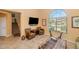 Bright living room featuring cozy seating, a large window, and neutral tones perfect for relaxation at 3932 E Melinda Dr, Phoenix, AZ 85050