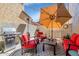 Outdoor patio featuring a grill, seating area with an umbrella, creating a cozy spot for relaxation at 3932 E Melinda Dr, Phoenix, AZ 85050