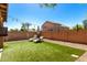 Relaxing backyard featuring artificial grass, lounge chairs, and string lights at 4034 E Mine Shaft Rd, San Tan Valley, AZ 85143