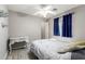 Bedroom featuring modern floors, a ceiling fan, and natural light at 4034 E Mine Shaft Rd, San Tan Valley, AZ 85143