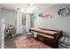 Cozy bedroom with natural light, ceiling fan, and charming decor at 4034 E Mine Shaft Rd, San Tan Valley, AZ 85143