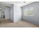 This versatile spare bedroom with neutral carpet offers a blank canvas for customization and comfortable living at 4034 E Mine Shaft Rd, San Tan Valley, AZ 85143