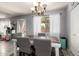 Dining room with natural light offers a stylish chandelier and backyard access at 4034 E Mine Shaft Rd, San Tan Valley, AZ 85143
