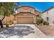 Charming two-story home with a well-maintained front yard and a two-car garage, featuring desert landscaping at 4034 E Mine Shaft Rd, San Tan Valley, AZ 85143