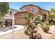 Inviting two-story home features desert landscaping and a prominent saguaro cactus at 4034 E Mine Shaft Rd, San Tan Valley, AZ 85143