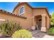 Welcoming front entrance features an arched entryway and well manicured desert landscaping at 4034 E Mine Shaft Rd, San Tan Valley, AZ 85143