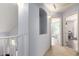 Hallway niche between rooms is lit by sconces, creating depth, visual interest, and a transitional space at 4034 E Mine Shaft Rd, San Tan Valley, AZ 85143