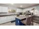 Modern kitchen featuring stainless steel appliances, a central island, and bright lighting at 4034 E Mine Shaft Rd, San Tan Valley, AZ 85143