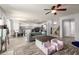 Bright living room with wood floors leads into the kitchen, offering an open and airy feel at 4034 E Mine Shaft Rd, San Tan Valley, AZ 85143