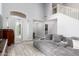 Spacious living room with vaulted ceilings, an upper level railing and gray wood look flooring at 4034 E Mine Shaft Rd, San Tan Valley, AZ 85143