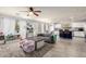Open concept living room flows into the kitchen, showcasing wood floors and natural light at 4034 E Mine Shaft Rd, San Tan Valley, AZ 85143