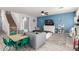 Cozy living room features a blue accent wall, playful decor, and direct access to a staircase at 4034 E Mine Shaft Rd, San Tan Valley, AZ 85143