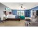 Serene main bedroom featuring a wooden accent wall and a sitting area at 4034 E Mine Shaft Rd, San Tan Valley, AZ 85143