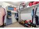 Spacious walk-in closet with custom shelving and storage solutions at 4034 E Mine Shaft Rd, San Tan Valley, AZ 85143