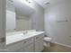 Bathroom featuring a vanity with a sink, a toilet, and a shower-tub combo at 41388 W Hopper Dr, Maricopa, AZ 85138